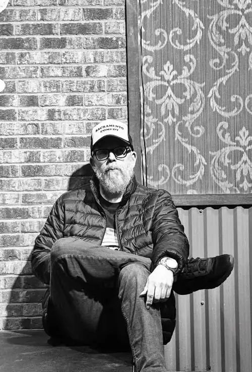 Johnny Taylor Jr. wearing a Sacramento Comedy hat