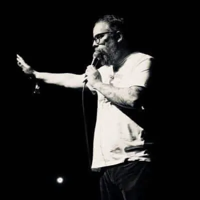 Johnny Taylor Jr. on stage with microphone